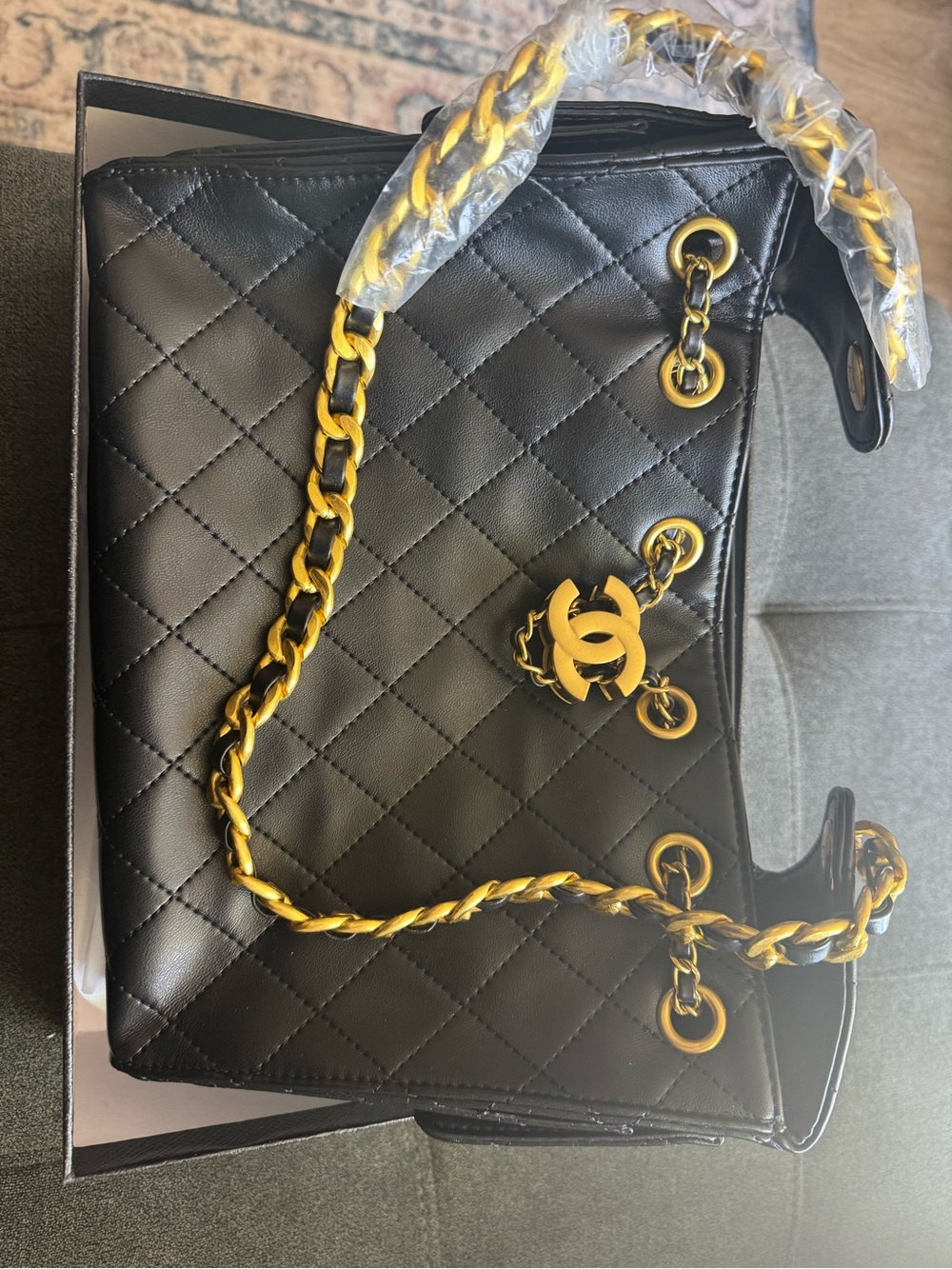 Black Quilted Shoulder Bag with Gold Chain and Logo Charm